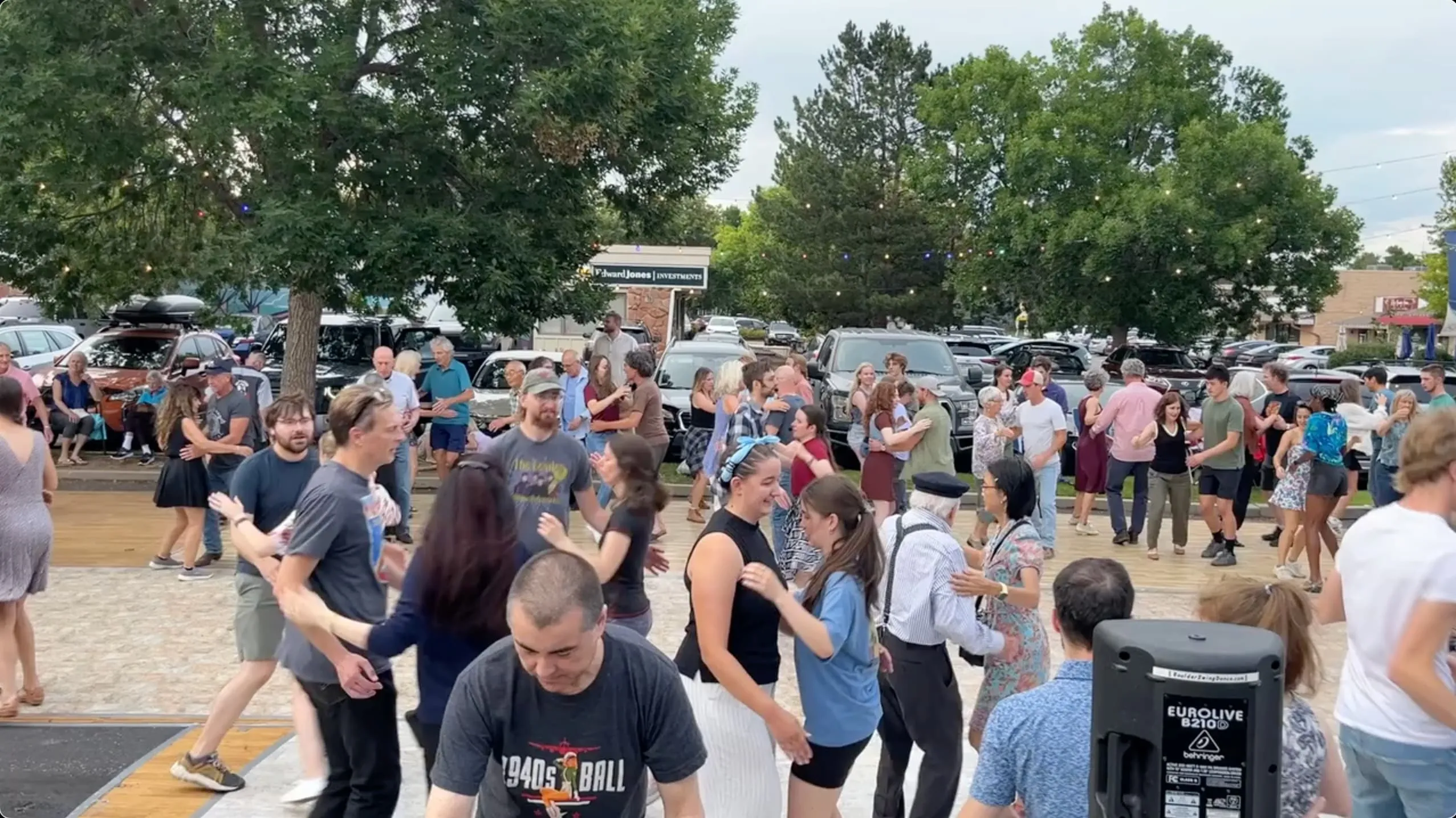 A crowd of dancers dancing on a public square.