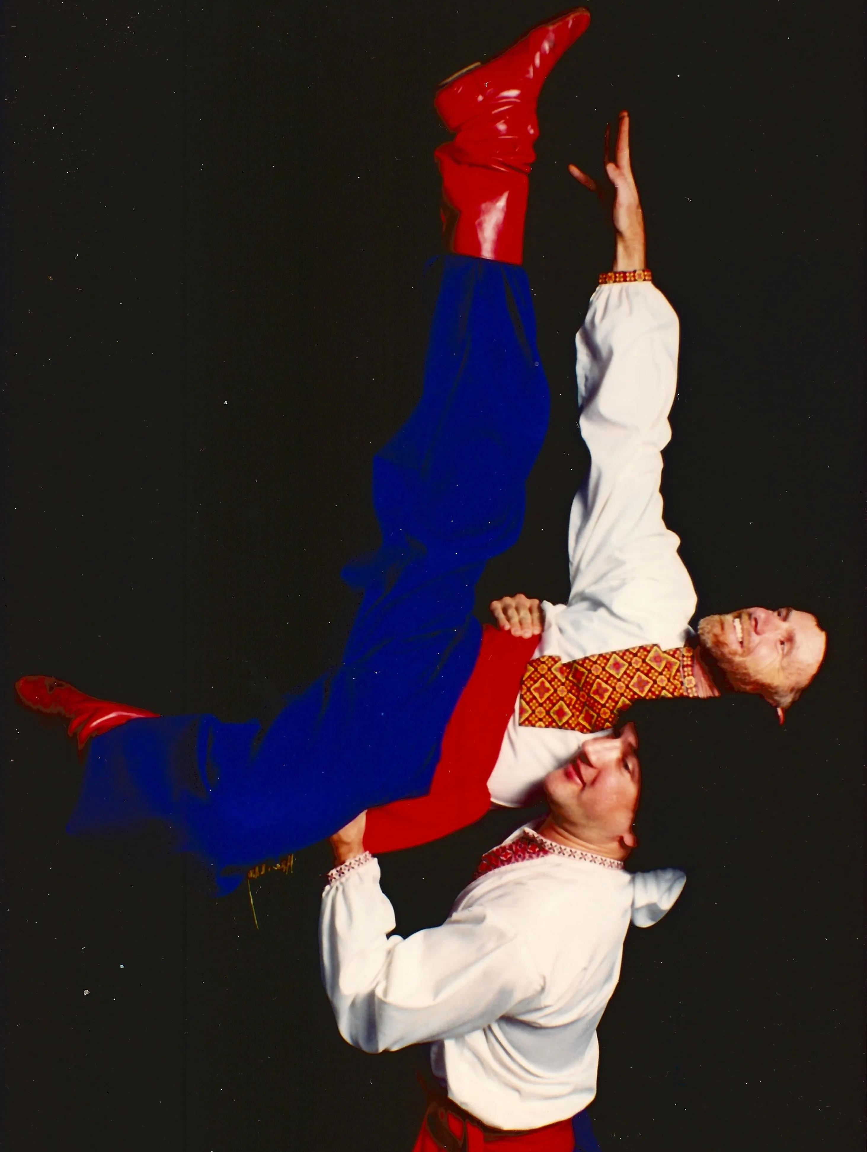 Tom Masterson and a dance partner performing a Ukrainian folk dance lift.