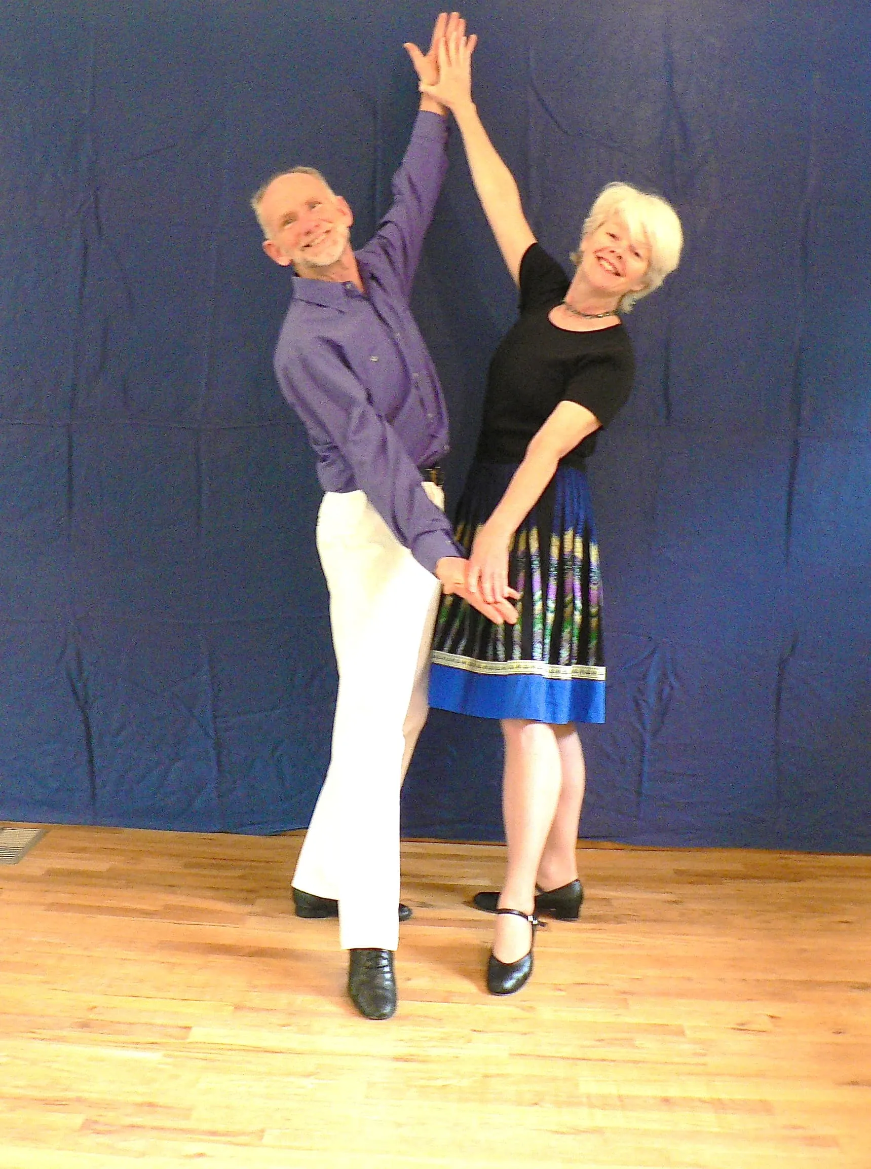 Tom Masterson and a dance partner performing a waltz move.